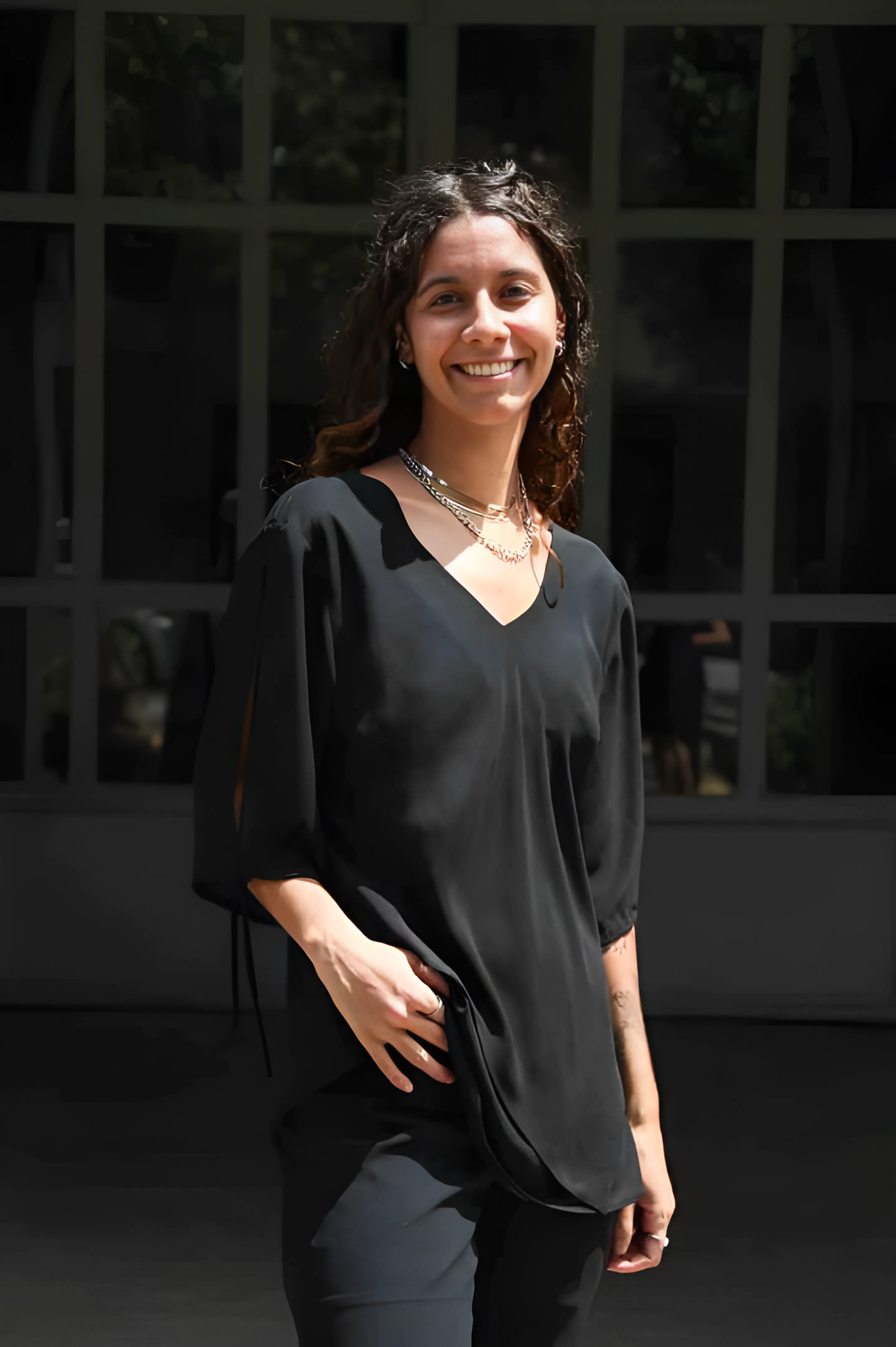 Foto de Carla Herculana, psicóloga, sorrindo